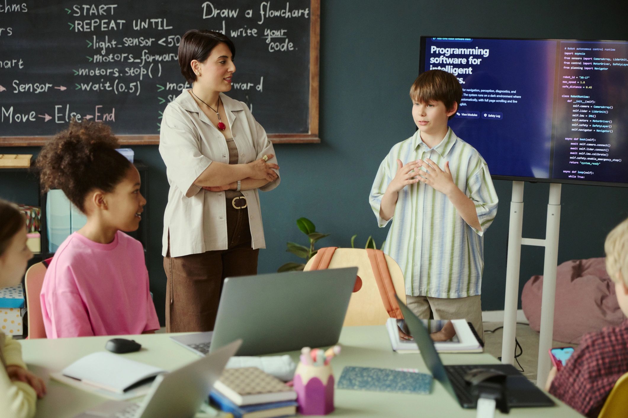 Teenage student presenting a coding project in class